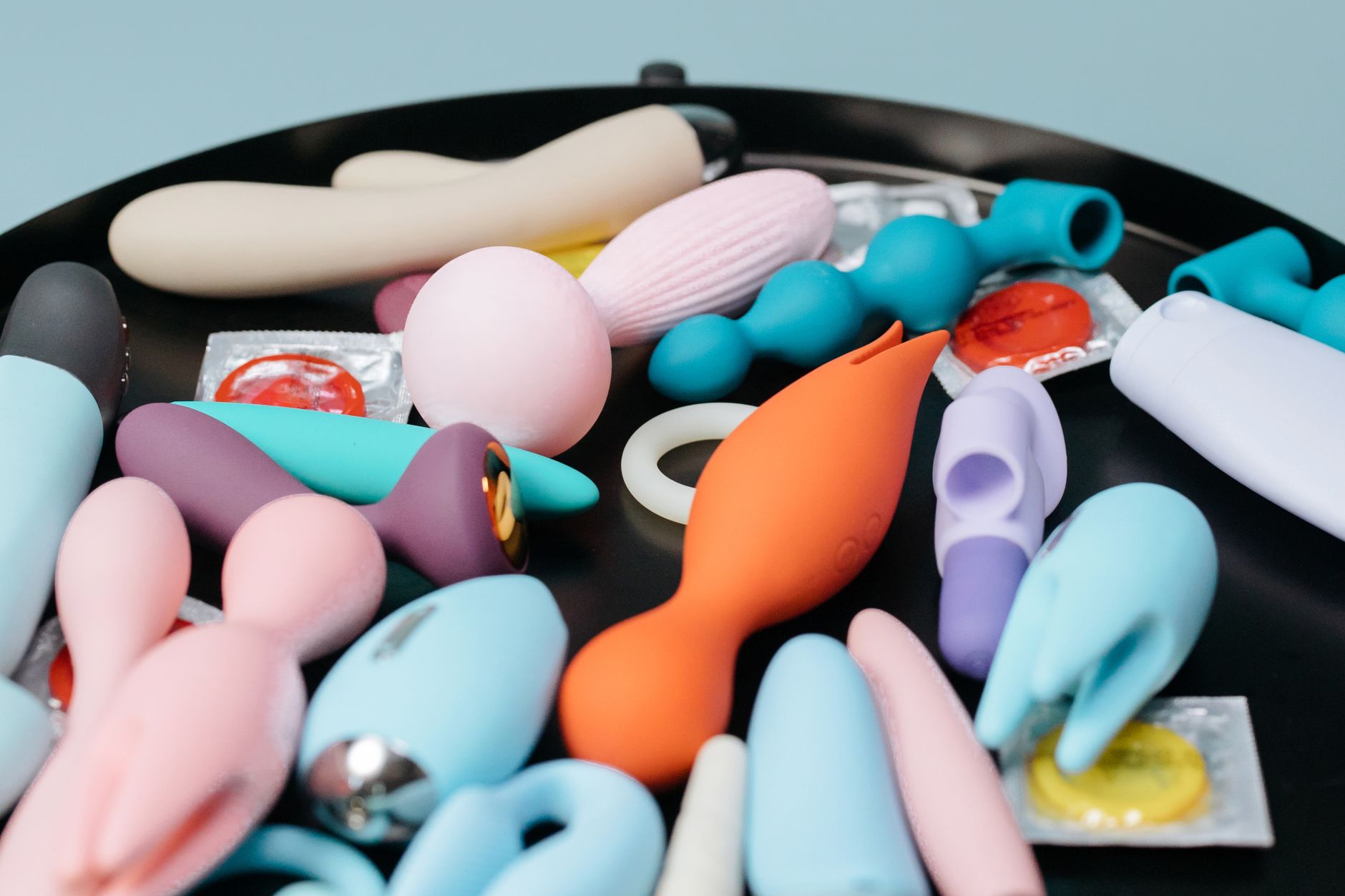 A vibrant collection of various lemon clitoral vibrators and adult toys on display